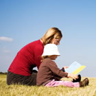 Child reading to parent