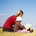 Child reading to parent
