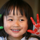 Young child with paint on hands